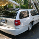 Illustration for article titled At $7,500, Would You Go To Town In This Custom 2000 Lincoln Town Car Station Wagon?